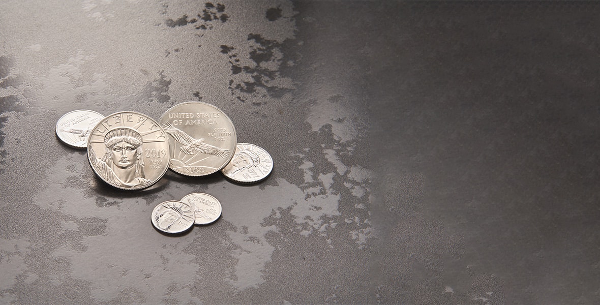 platinum american eagle coins on grey background