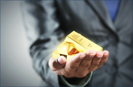 Golden bars on the womans hand